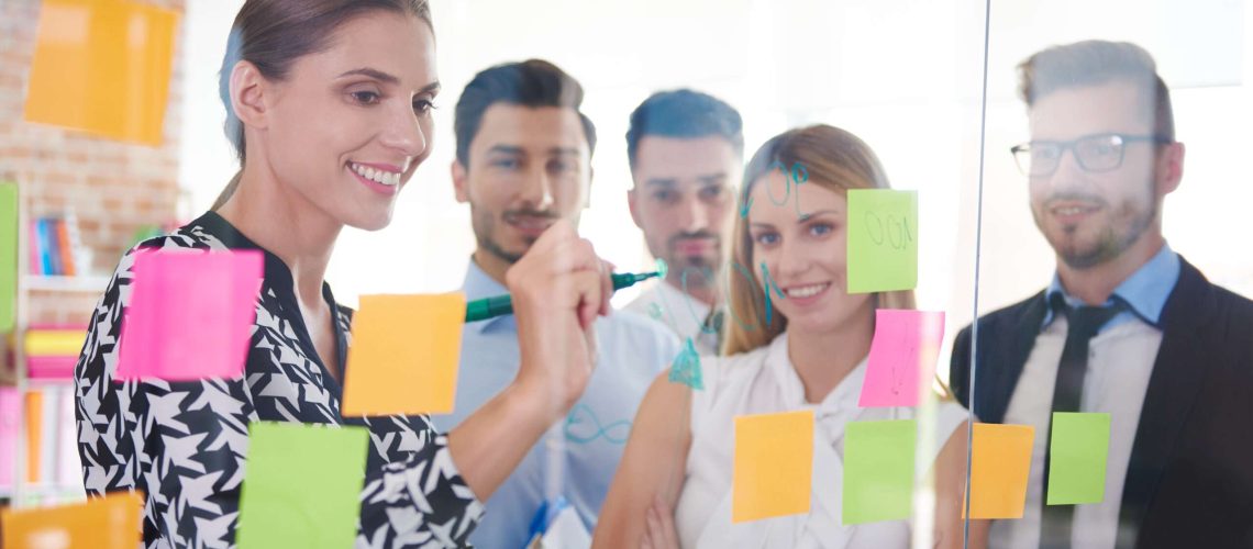 Office workers and colorful papers